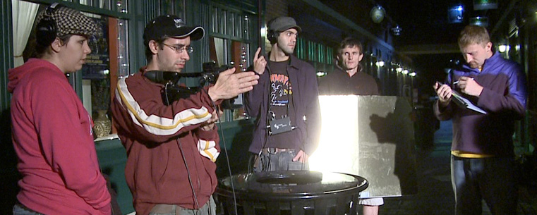 The film crew of "Breaking News," the first full-length feature film created by Kent State students, prepares a shot late at night in Acorn Alley in downtown Kent