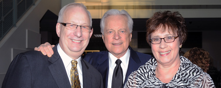 <p>President Lester Lefton and wife, Linda, meet Robert Osborne, host of Turner Classic Movies, during the reception for the 25th anniversary celebration of the Kent State University Museum.</p>