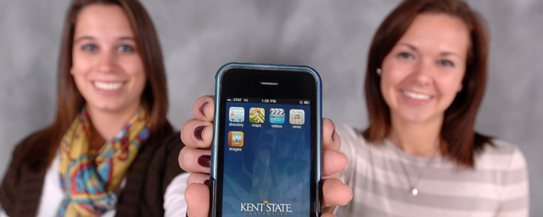 Two Kent State students show off KSUMobile on their iPhone.<br />