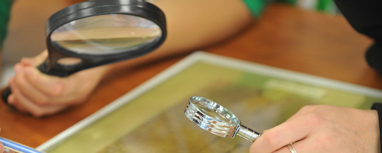 Magnifying glasses and a good set of eyes, along with knowledge of ancient Greek, are some of the tools used to translate documents of this nature.