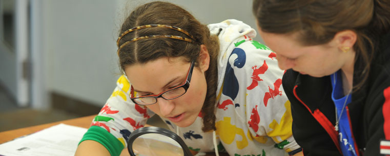 Kent State undergraduate students Ola Sobieska and Heather Benya study an ancient Greek papyrus document.