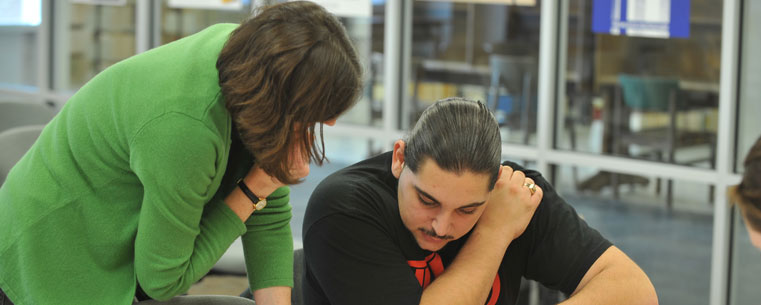 Dr. Jennifer Larson, chair of Kent State's Department of Modern and Classical Language Studies, works with undergraduate student Tommy Walsh to translate an ancient Greek text.