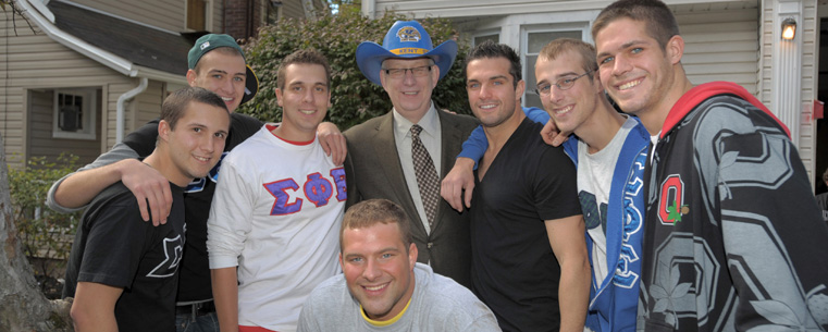 Dr. Lefton visits the fraternity houses near campus. The visits have become a tradition on Homecoming day.