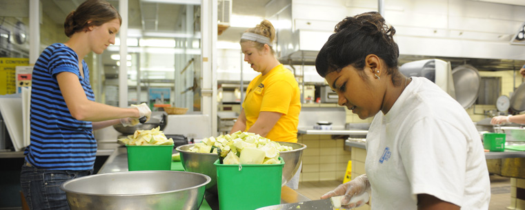 Kent State students volunteer at the Campus Kitchen at Kent State by preparing food in Beall Hall.