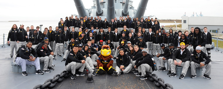The entire Kent State football team gathers for a photo aboard the World War II battleship USS Alabama, moored in Mobile, Alabama.
