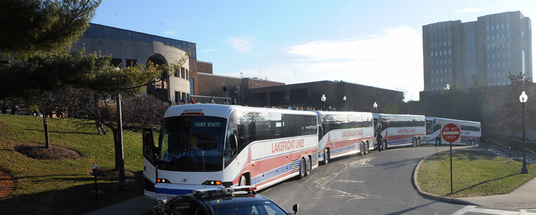 The Kent State football team prepares to leave for the Mid-American Conference championship game in Detroit with a police escort to Kent’s city limits.