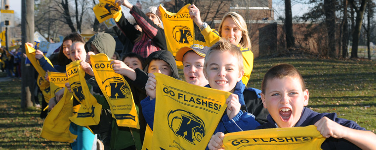 Students from Franklin Elementary School in Kent line Route 43 in a show of support for the Kent State football team as the team’s buses head to Detroit for Friday night’s Mid-American Conference championship game.