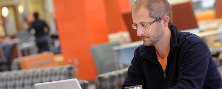 A Kent State student studies in the Fab Fourth located on the fourth floor of the library.