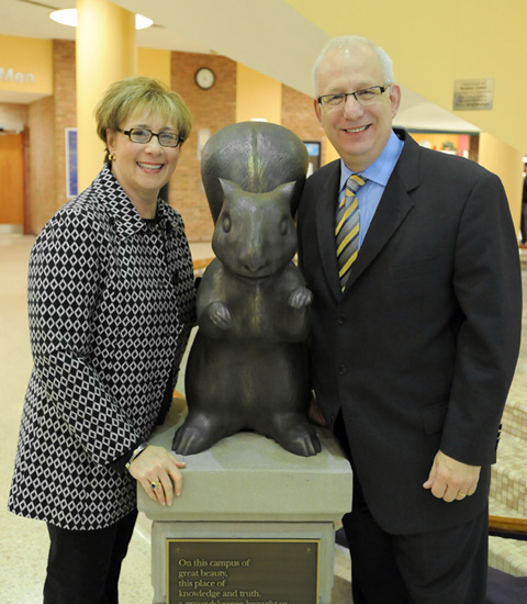 Linda Lefton and President Lester A. Lefton are pictured here after unveiling a bronze squirrel in the Kent Student Center to kick off Kent State's centennial celebration.