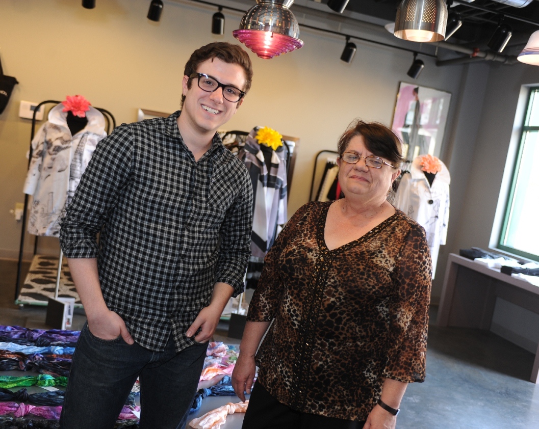 Scott Bunner, a junior Kent State University student majoring in merchandising and manager of the university's new Fashion School, is pictured with Nancy Stanforth, Kent State faculty advisor of the store