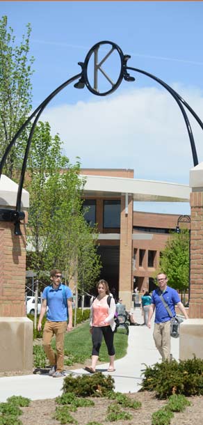 Kent State students walk to class through one of the gates on the Student Green.