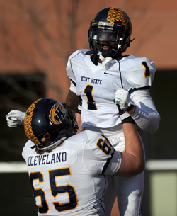 Kent State junior running back Dri Archer, 1, runs the ball toward the end zone to score a touch down to tie the game against Bowling Green and is held up in celebration by teammate Kent Cleveland, 65. Photo courtesy of Kristin Bauer, The Record-Courier.