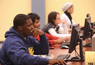 Photo of Kent State students using computers in the Library