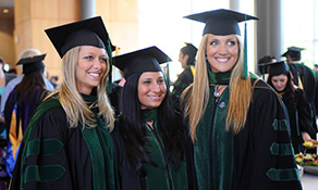 Megan Oltman, Christina Schilero and Alicia Wade celebrate graduating from Kent State’s College of Podiatric Medicine. 