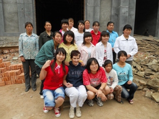 Photo from Guanlan's Sisters: A Family Journey with Kent State Associate Professor Vilma Seeberg second from the left in the front row and daughter, Zoë Guanlan, on her right