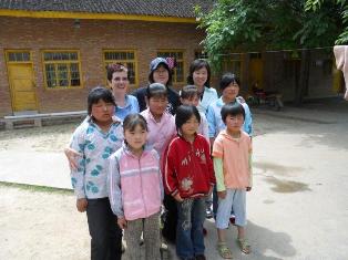 Photo from Guanlan's Sisters: A Family Journey, with Kent State Associate Professor Vilma Seeberg (back row, far left) pictured with a group of students 