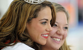 The day after being named Miss Ohio 2013, Heather Wells (left) makes an appearance at the Richland Mall in Mansfield, Ohio, and smiles for a photo with friend and former Miss Ohio contestant Chelsi Howman (right). (Proto credit: Jason J. Molyet/Mansfield News Journal)