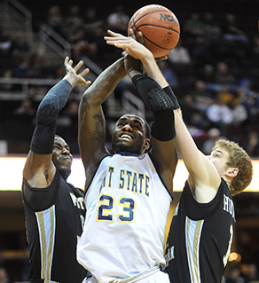 A Kent State player is fouled on the way to the basket during the 2012 MAC Tournament in Cleveland.